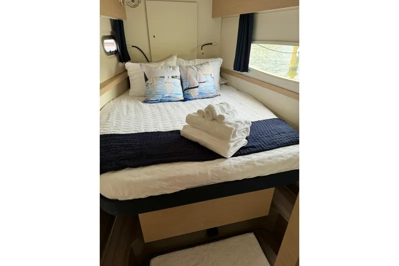 Slide: The Image of Cozy cabin interior of 2018 Fountaine Pajot Helia 44 Evolution with neatly arranged bed linens. - 82