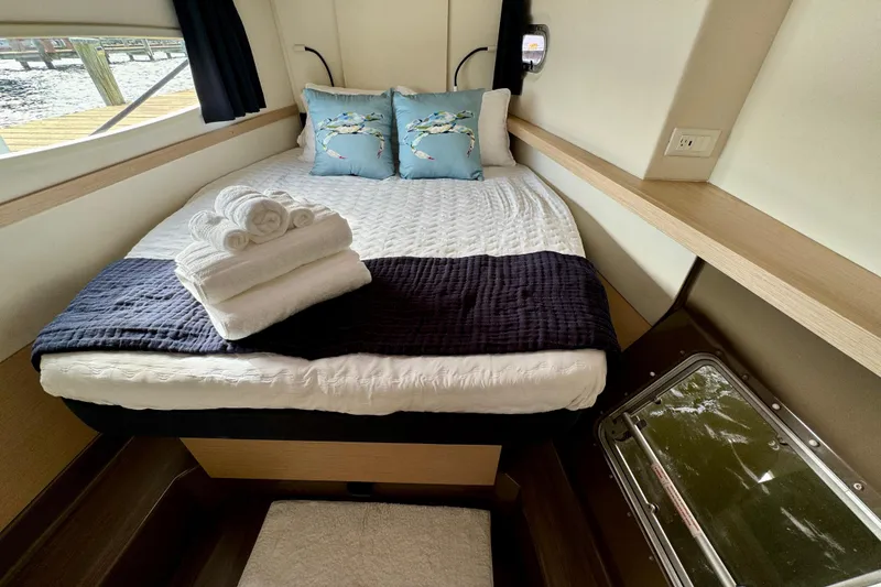 Slide: The Image of Cabin interior of 2018 Fountaine Pajot Helia 44 Evolution with bed and nautical decor. - 87