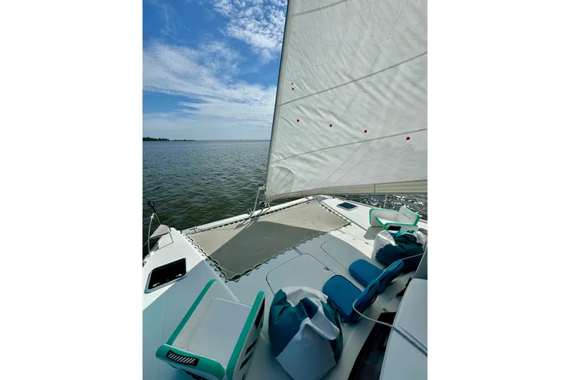 Slide: The Image of 2018 Fountaine Pajot Helia 44 Evolution sailing on open water under a clear sky. - 9