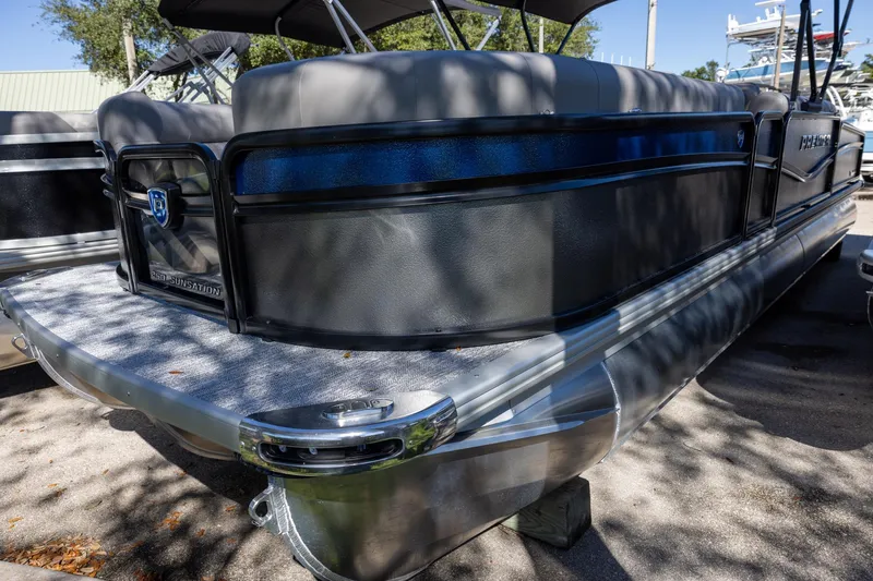 The Image of 2026 Premier 250 Sunsation RS pontoon boat, sleek design, docked outdoors. - 0