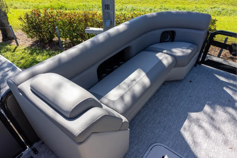 Slide: The Image of 2026 Premier 250 Sunsation RS boat with luxurious gray seating and outdoor view. - 11
