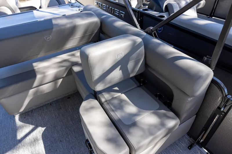 Slide: The Image of Luxurious seating on 2026 Premier 250 Sunsation RS pontoon boat, featuring sleek gray upholstery. - 14