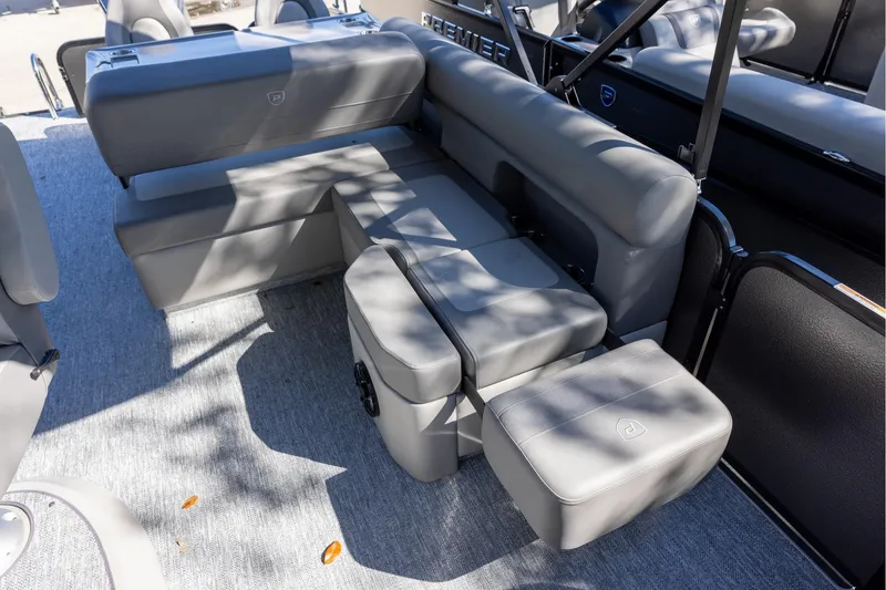 Slide: The Image of Luxurious seating on 2026 Premier 250 Sunsation RS pontoon boat, featuring sleek gray upholstery. - 15