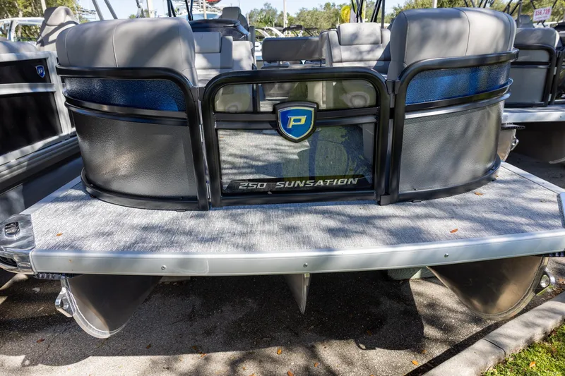 Slide: The Image of 2026 Premier 250 Sunsation RS pontoon boat, rear view with seating and logo. - 2