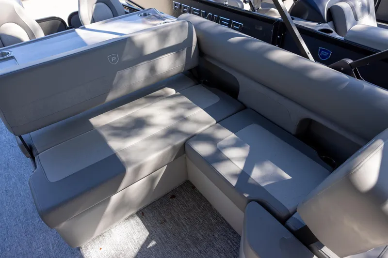 Slide: The Image of 2026 Premier 250 Sunsation RS boat interior with gray seating and cup holders. - 8