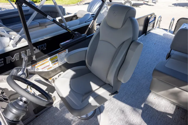 Slide: The Image of Captain's chair in 2026 Premier 250 Sunsation RS pontoon boat cockpit. - 9