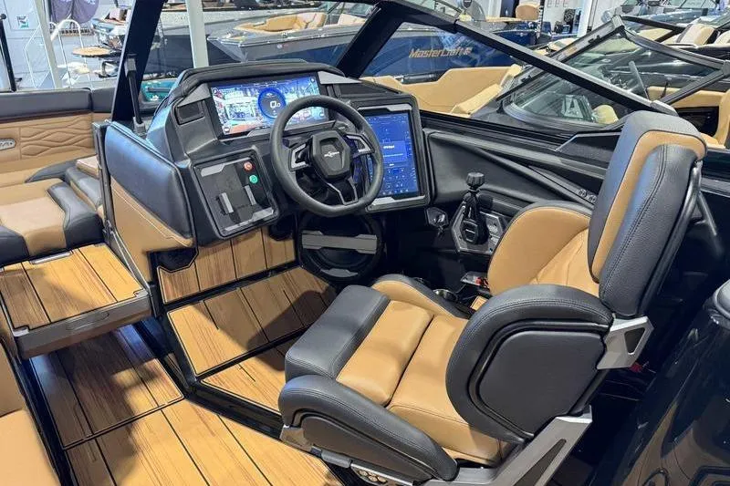 Slide: The Image of 2026 Supra SE boat interior with advanced dashboard and luxurious seating. - 13