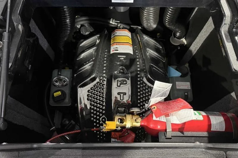 Slide: The Image of 2026 Supra SE engine compartment with Raptor engine and fire extinguisher. - 16