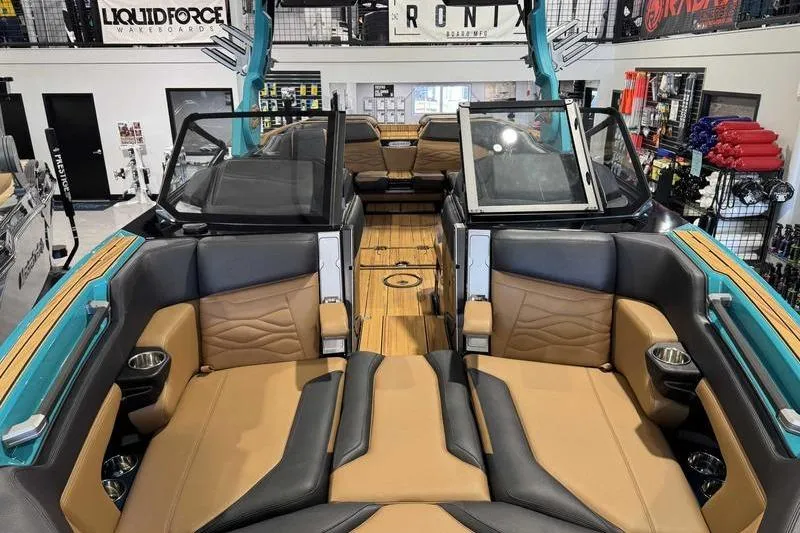 Slide: The Image of 2026 Supra SE boat interior with tan and black seating, showcasing luxury and comfort. - 17