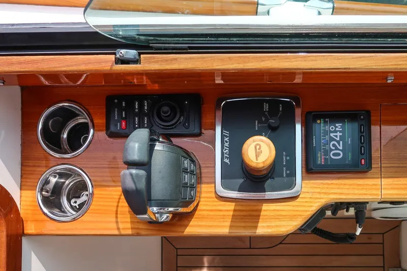 Slide: The Image of Hinckley Picnic Boat 37 MKIII 2015 dashboard with controls and navigation display. - 38