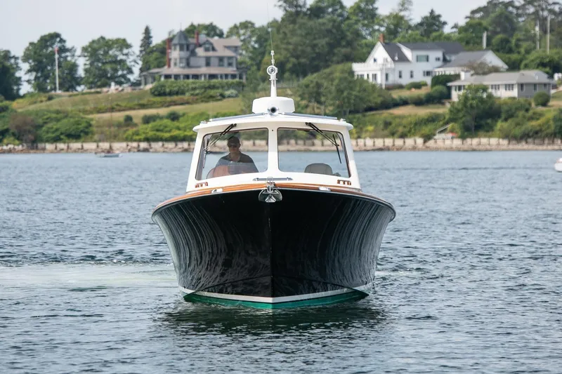 Slide: The Image of 2015 Hinckley Picnic Boat 37 MKIII cruising on a scenic waterway. - 4