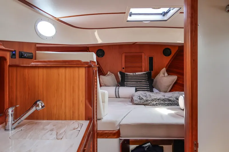 Slide: The Image of Luxurious interior of 2015 Hinckley Picnic Boat 37 MKIII with cozy seating and elegant wood finish. - 44