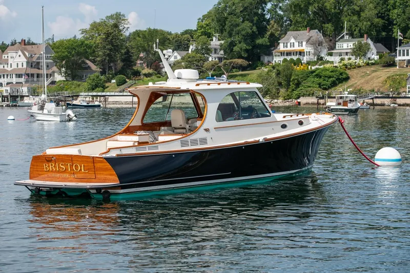 Slide: The Image of 2015 Hinckley Picnic Boat 37 MKIII moored in scenic harbor. - 12