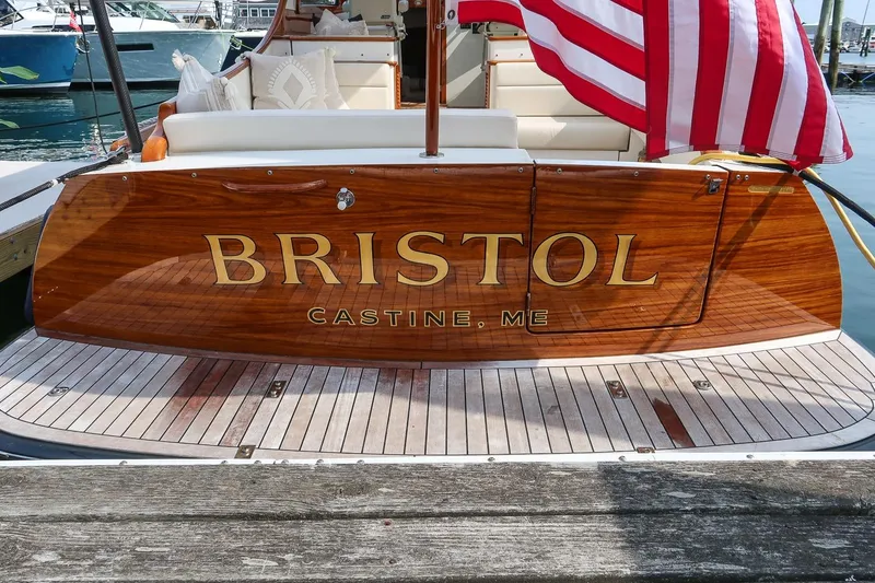 Slide: The Image of Hinckley Picnic Boat 37 MKIII, 2015, docked with American flag, "Bristol" nameplate, Castine, ME. - 27