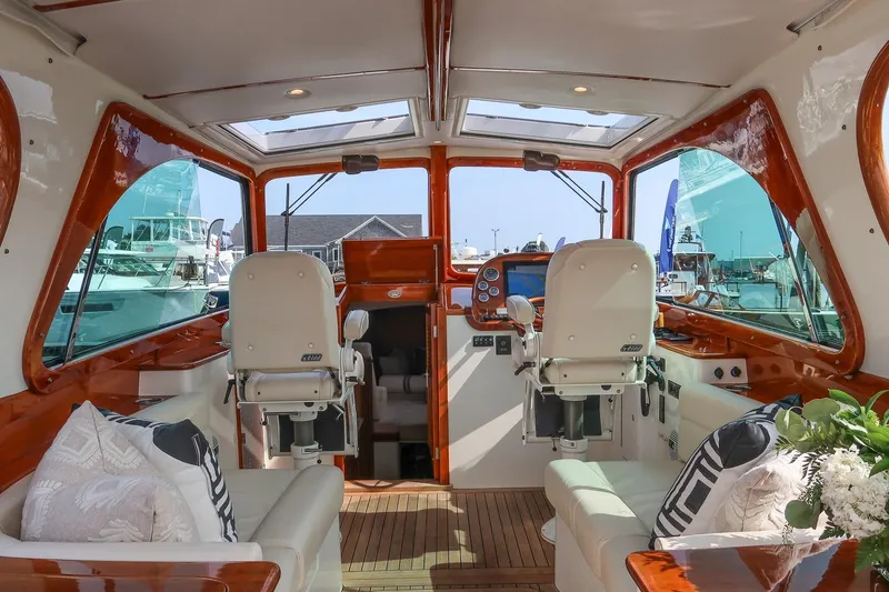 Slide: The Image of Interior of 2015 Hinckley Picnic Boat 37 MKIII with luxurious seating and helm. - 34