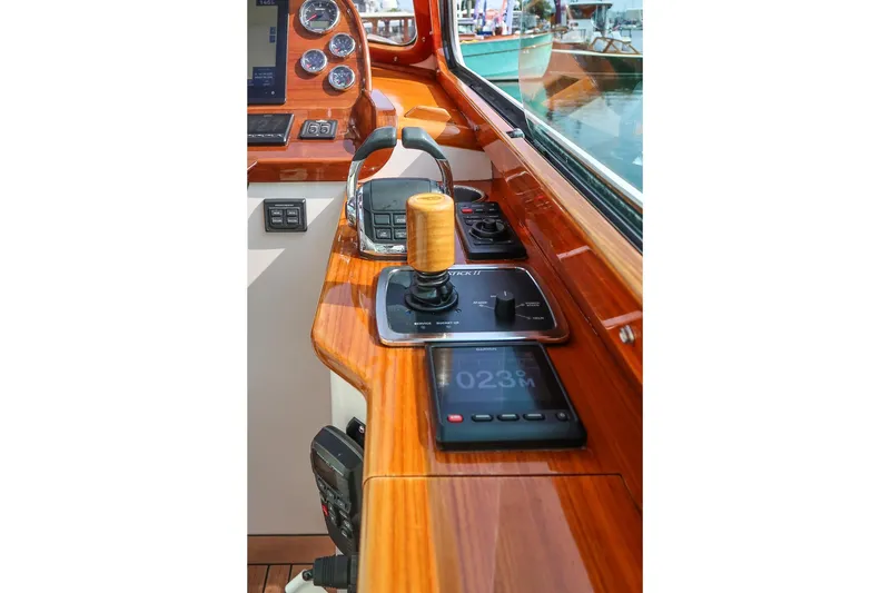 Slide: The Image of Hinckley Picnic Boat 37 MKIII 2015 helm with polished wood and modern controls. - 39