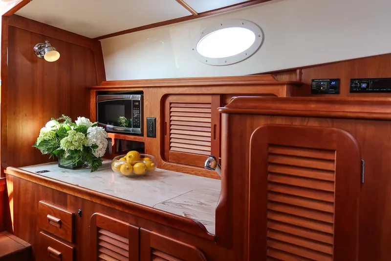 Slide: The Image of Luxurious interior of 2015 Hinckley Picnic Boat 37 MKIII with elegant wood finish. - 43