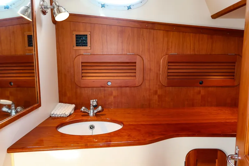Slide: The Image of Luxurious wooden bathroom interior of 2015 Hinckley Picnic Boat 37 MKIII with sink and mirror. - 46