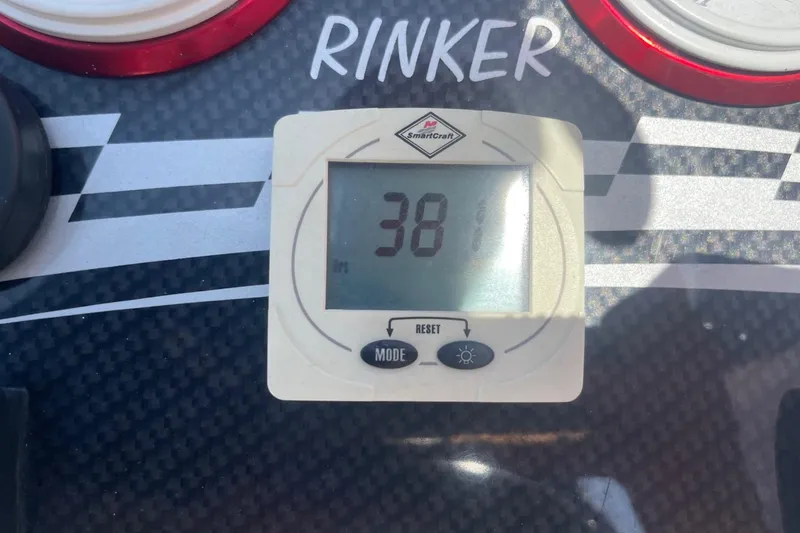 Slide: The Image of Digital display on 2001 Rinker 262 Captiva boat dashboard showing 381 hours. - 22