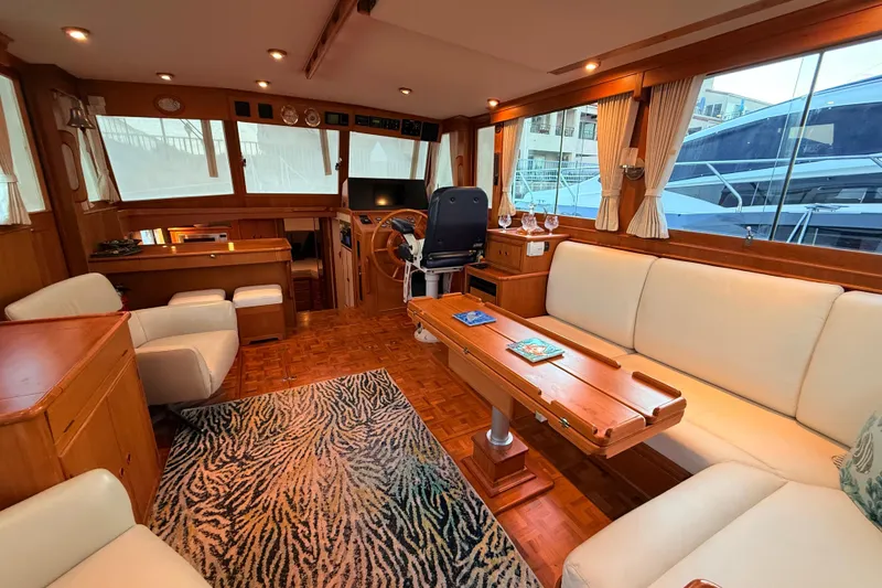 Slide: The Image of Luxurious interior of 2001 Grand Banks 46 Classic yacht with elegant seating and wooden accents. - 10