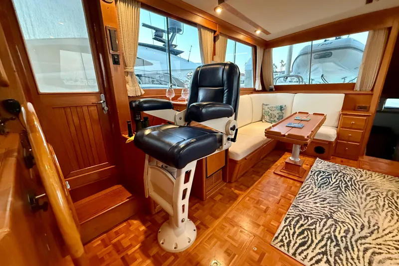 Slide: The Image of Interior of 2001 Grand Banks 46 Classic yacht with helm chair and seating area. - 12