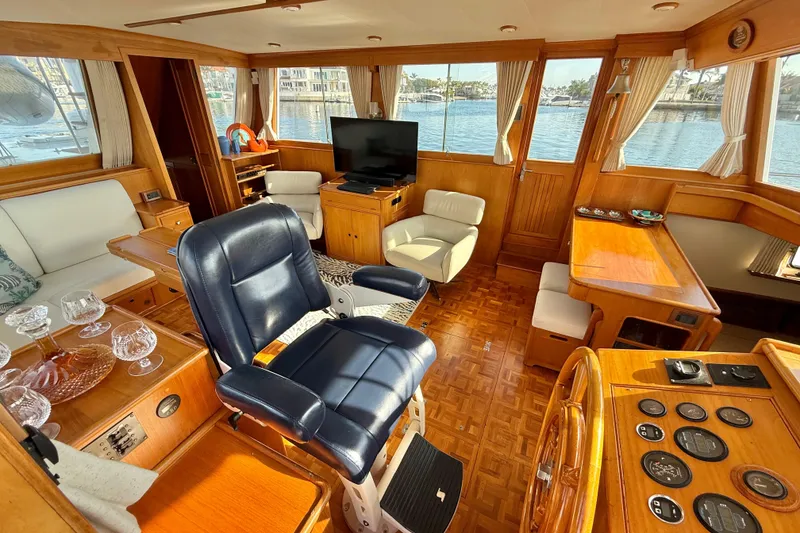Slide: The Image of Luxurious interior of 2001 Grand Banks 46 Classic yacht with elegant wood finish and seating. - 13