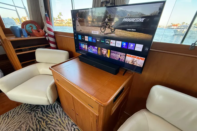 Slide: The Image of Interior of 2001 Grand Banks 46 Classic yacht with TV and comfortable seating. - 18