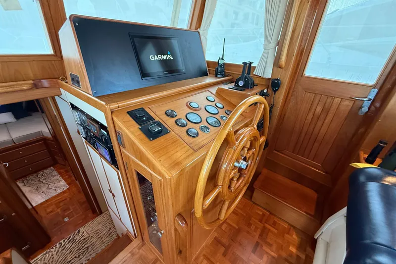 Slide: The Image of Helm of 2001 Grand Banks 46 Classic yacht with Garmin navigation system and wooden steering wheel. - 20