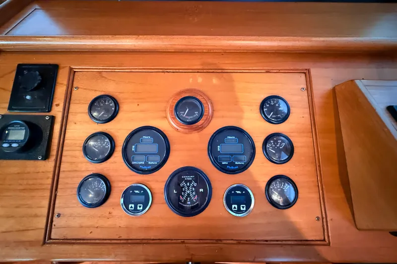 Slide: The Image of Control panel of 2001 Grand Banks 46 Classic yacht with various gauges and dials. - 24
