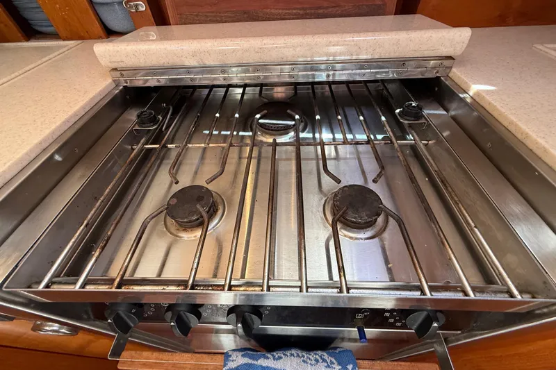 Slide: The Image of Stainless steel stove in 2001 Grand Banks 46 Classic yacht kitchen. - 33