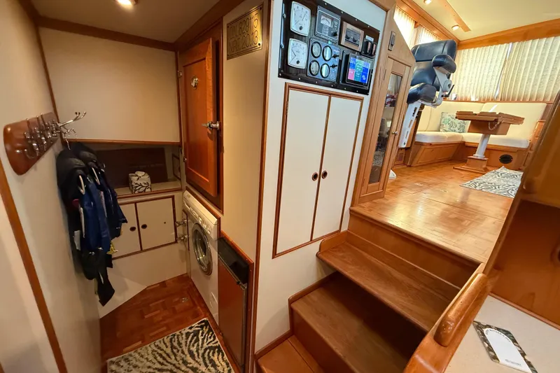 Slide: The Image of Interior of 2001 Grand Banks 46 Classic yacht with wood finishes and laundry area. - 36