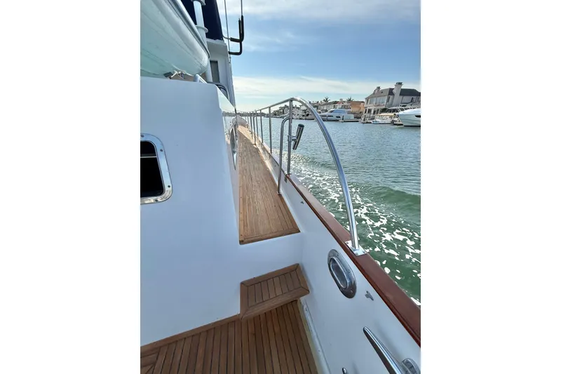 Slide: The Image of Side deck view of 2001 Grand Banks 46 Classic yacht with teak flooring. - 46