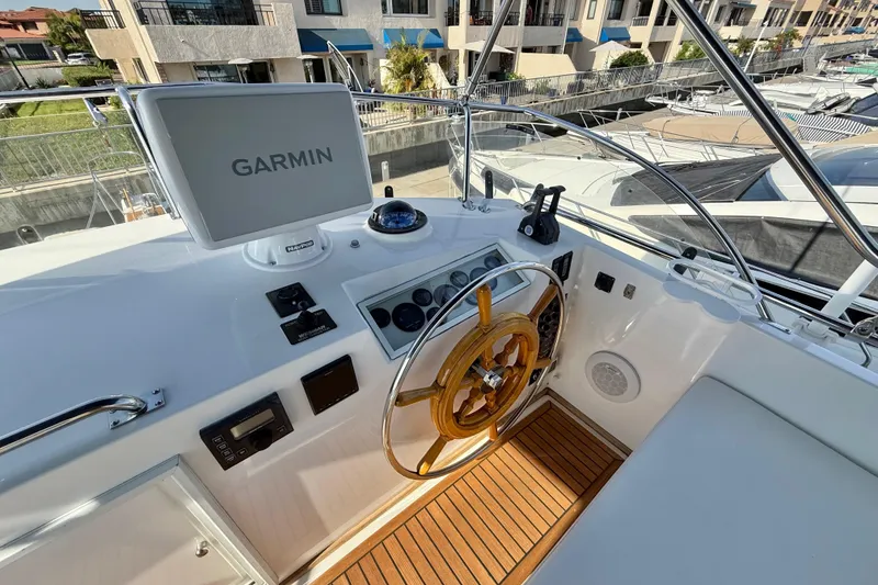 Slide: The Image of Helm of 2001 Grand Banks 46 Classic with Garmin navigation system. - 47