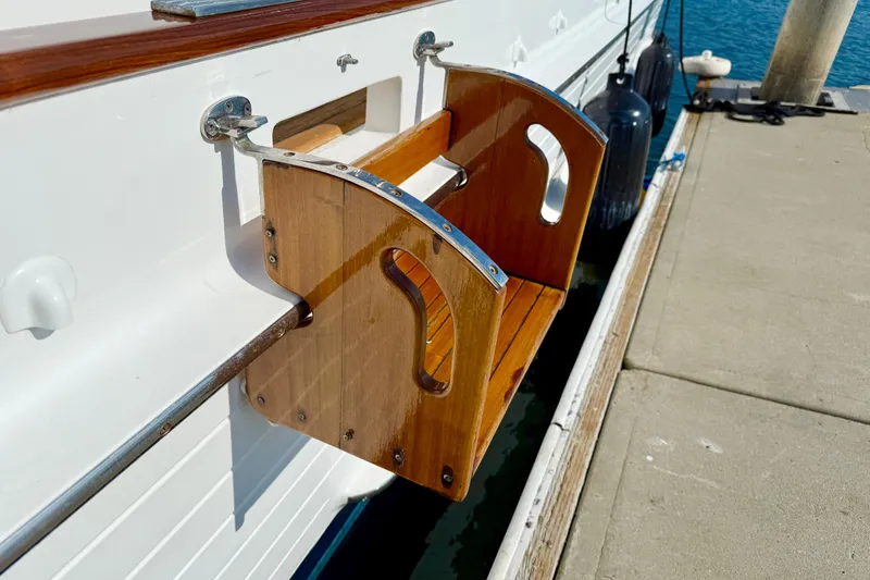 Slide: The Image of Wooden boarding step on 2001 Grand Banks 46 Classic yacht docked at marina. - 55
