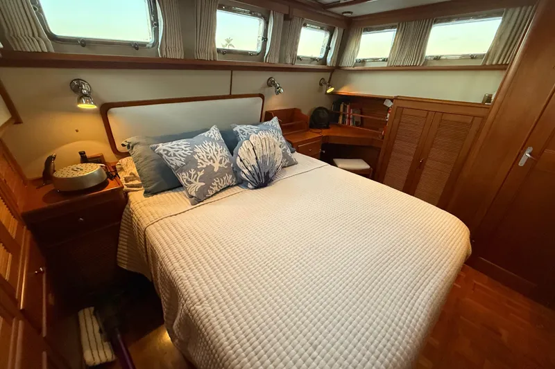 Slide: The Image of Luxurious cabin interior of 2001 Grand Banks 46 Classic yacht with cozy bedding. - 59