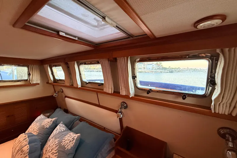 Slide: The Image of Cozy cabin interior of 2001 Grand Banks 46 Classic yacht with scenic window views. - 60