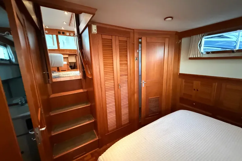 Slide: The Image of Interior of 2001 Grand Banks 46 Classic yacht with wooden cabinetry and stairs. - 61