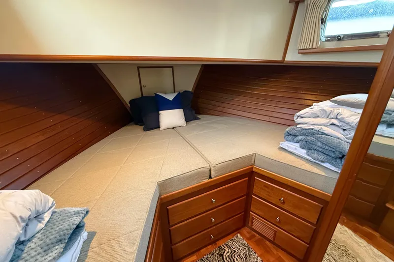 Slide: The Image of Cozy cabin interior of 2001 Grand Banks 46 Classic with wood paneling and bedding. - 65