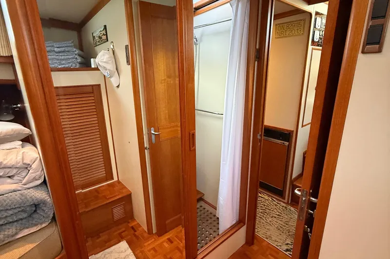 Slide: The Image of Interior of 2001 Grand Banks 46 Classic yacht, featuring wood finishes and cozy cabin space. - 69