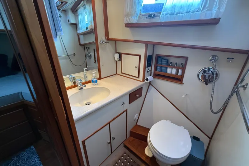 Slide: The Image of Bathroom interior of 2001 Grand Banks 46 Classic yacht, featuring sink, toilet, and shower. - 71