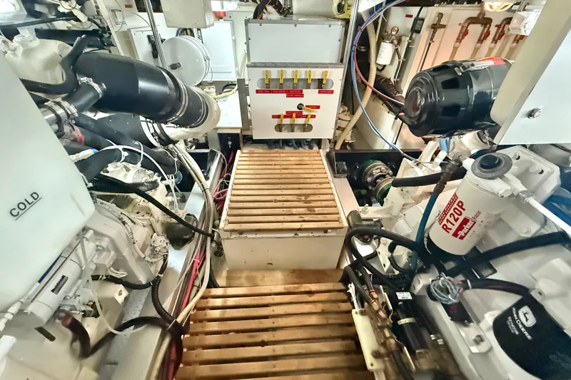 Slide: The Image of Engine room of 2001 Grand Banks 46 Classic yacht, featuring mechanical components and equipment. - 80