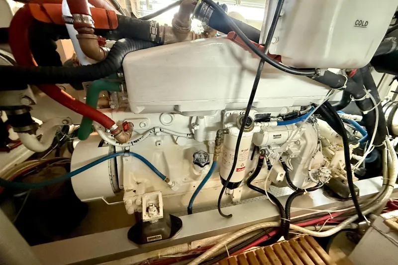 Slide: The Image of Engine room of 2001 Grand Banks 46 Classic yacht, showcasing detailed mechanical components. - 82