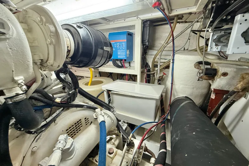 Slide: The Image of Engine room of 2001 Grand Banks 46 Classic yacht, showcasing mechanical components and wiring. - 88