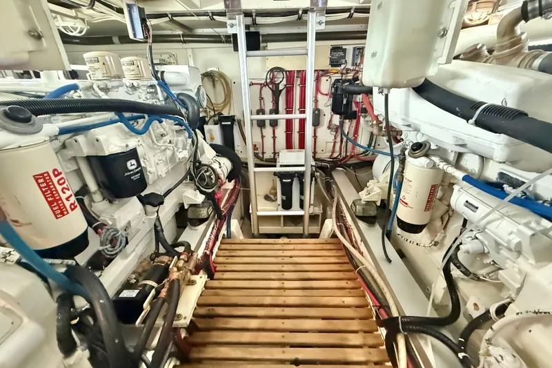 Slide: The Image of Engine room of 2001 Grand Banks 46 Classic yacht, showcasing dual engines and equipment. - 89