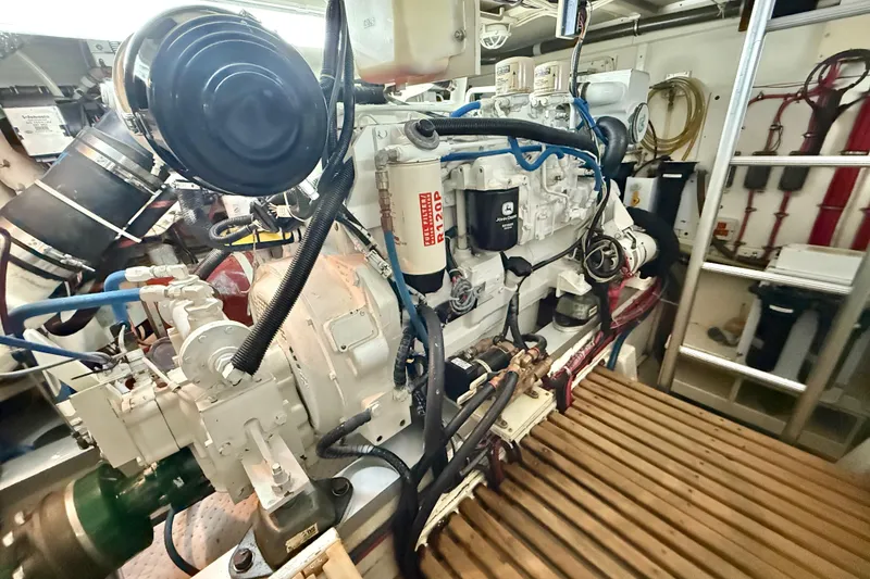 Slide: The Image of Engine room of 2001 Grand Banks 46 Classic yacht, showcasing detailed machinery and components. - 91