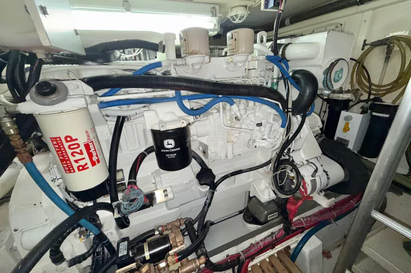 Slide: The Image of Engine room of 2001 Grand Banks 46 Classic yacht with visible fuel filter and wiring. - 96