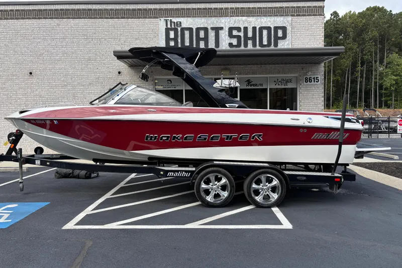 The Image of 2008 Malibu Wakesetter 23 LSV boat on trailer outside The Boat Shop. - 0