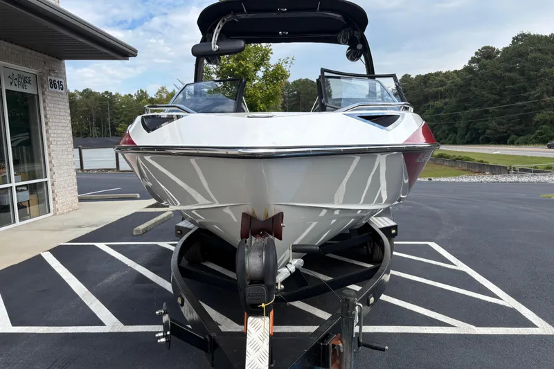 Slide: The Image of 2008 Malibu Wakesetter 23 LSV boat on trailer in parking lot. - 1