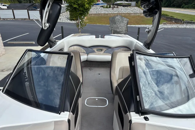 Slide: The Image of 2008 Malibu Wakesetter 23 LSV interior with open windshield and seating area. - 11