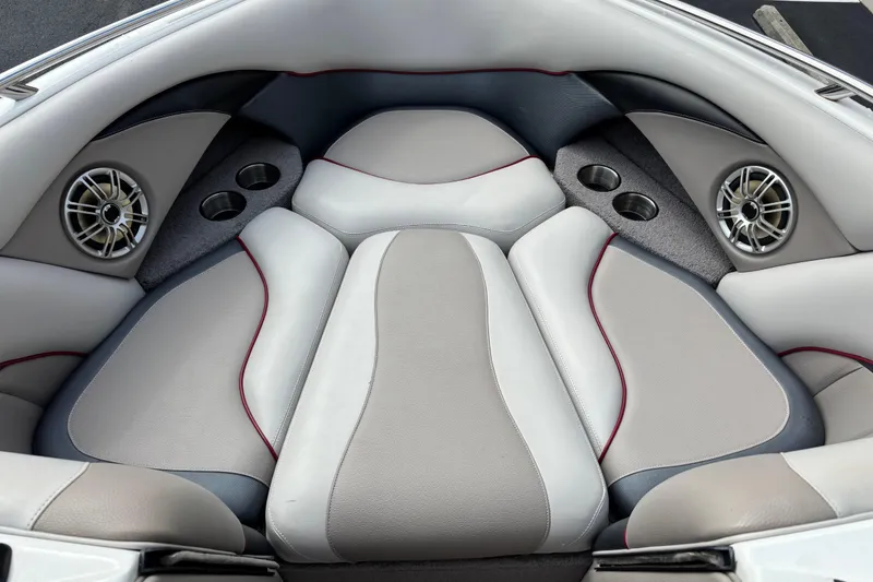 Slide: The Image of 2008 Malibu Wakesetter 23 LSV interior with cushioned seating and built-in speakers. - 6